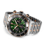 The Breitling Super Chronomat B01 44 is a luxury chronograph watch with an emerald dial, gold and black bezel, three subdials, a two-tone silver and gold metal bracelet, and the renowned Breitling Manufacture 01 Movement.