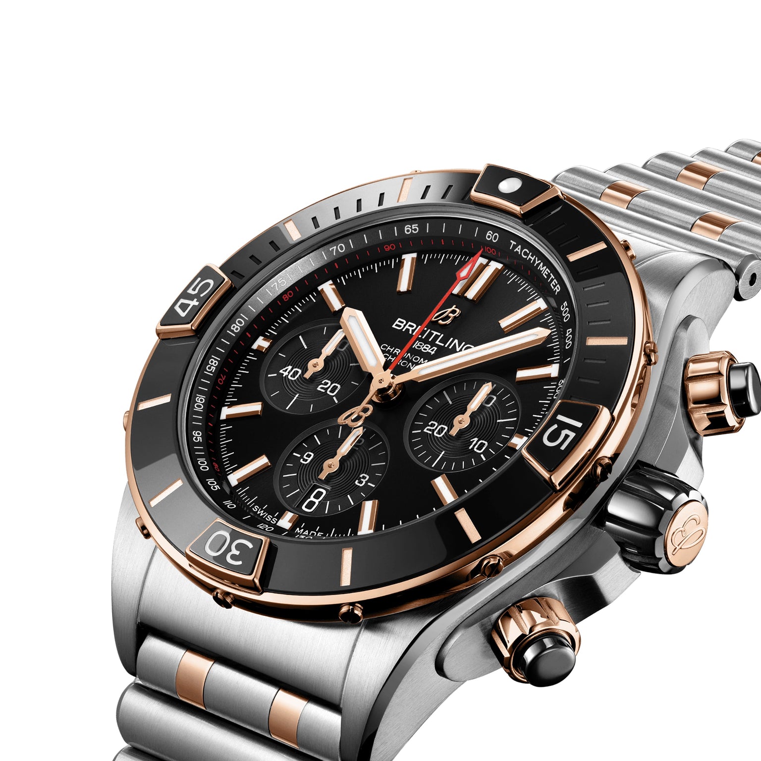 A close-up of the Breitling Super Chronomat B01 44 wristwatch, featuring a black dial, 18ct rose gold and silver accents, and a metal bracelet. COSC certified for precision.