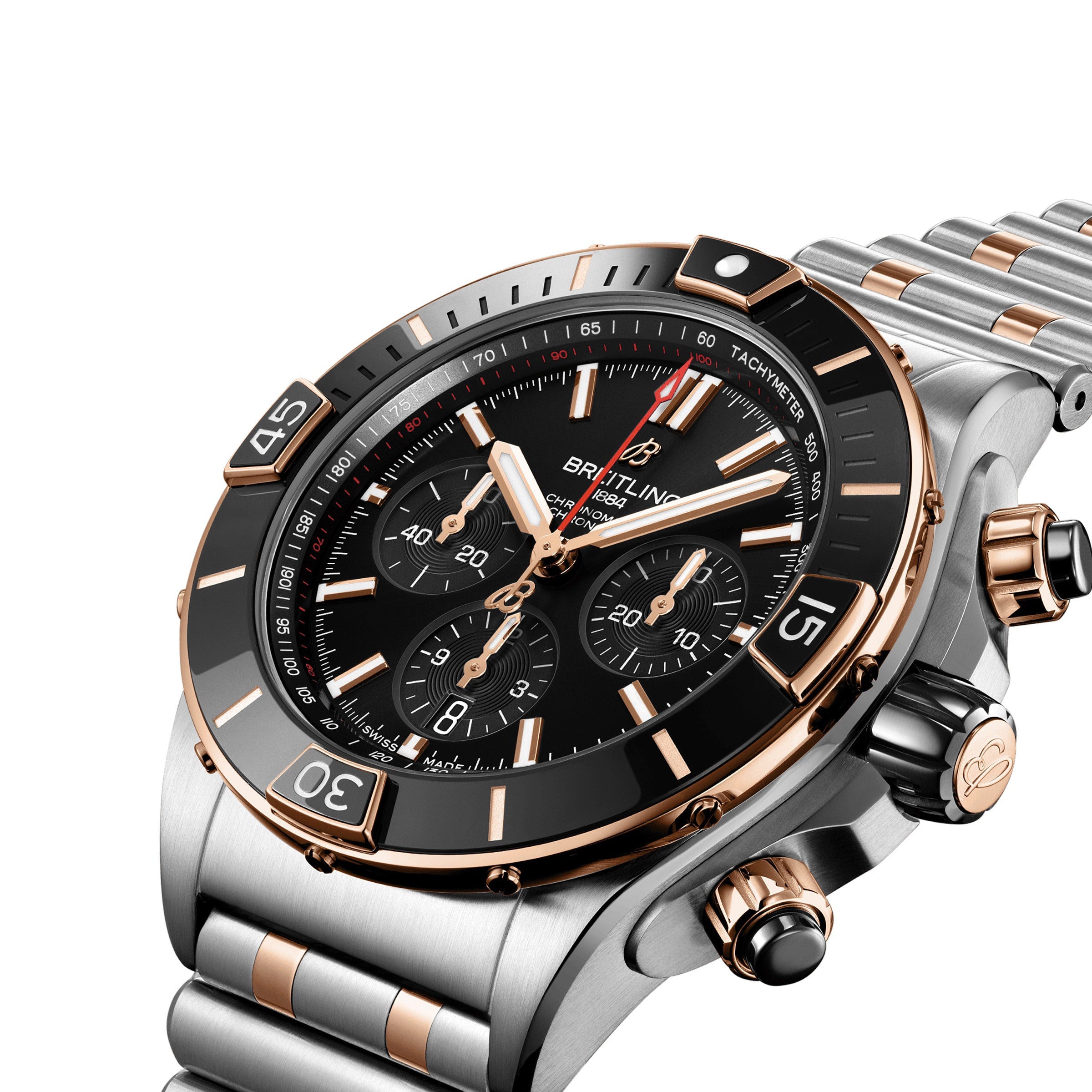 A close-up of the Breitling Super Chronomat B01 44 wristwatch, featuring a black dial, 18ct rose gold and silver accents, and a metal bracelet. COSC certified for precision.