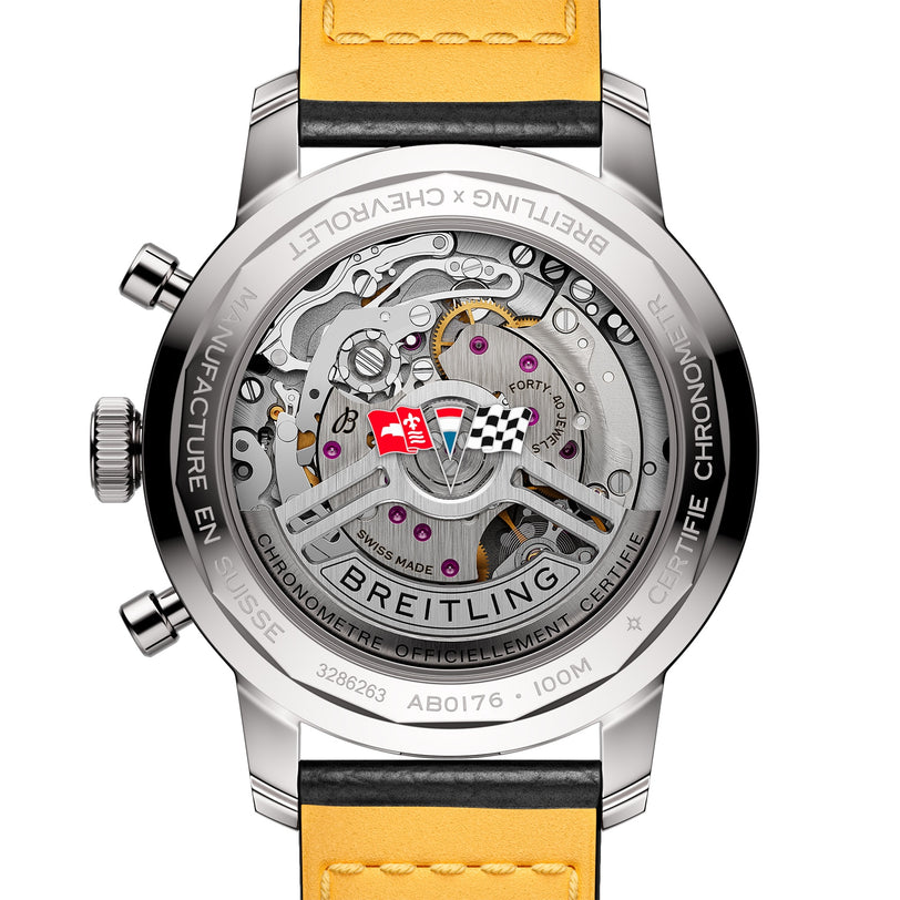 Close-up of the back of the Breitling Top Time B01 Chevrolet Corvette watch, featuring its exposed Manufacture Calibre 01 movement, engraved details, and yellow leather strap—an elegant tribute to classic automotive spirit.