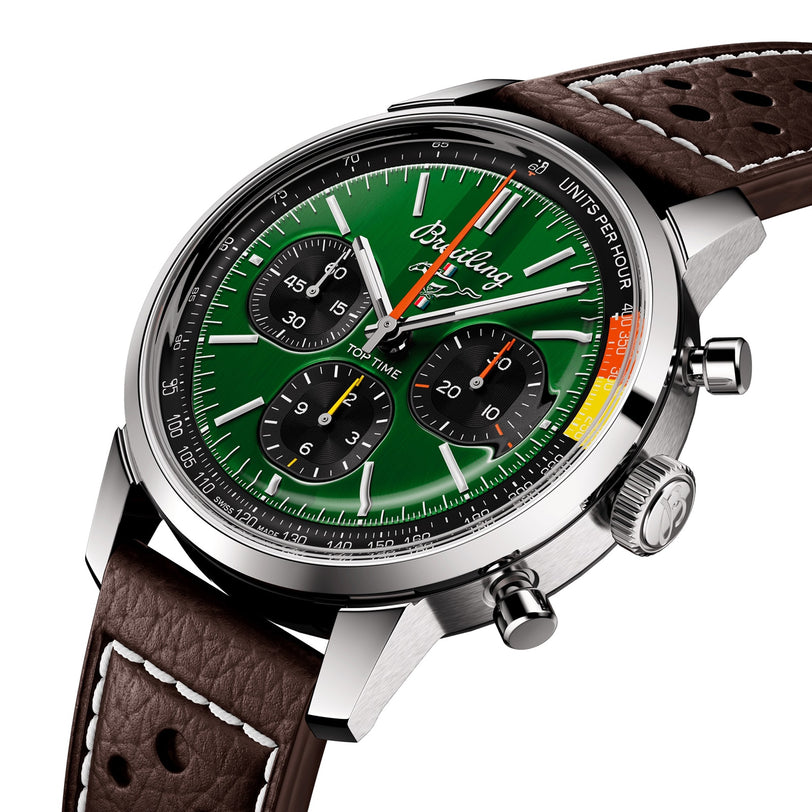 A close-up of the Breitling Top Time B01 Ford Mustang shows its racing green dial, brown perforated leather strap, stainless steel case, and precise Breitling Manufacture Calibre 01 movement.