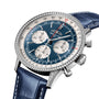Close-up of a Breitling Navitimer B01 Chronograph 41 featuring a blue dial with three subdials, diamond bezel, stainless steel case, and blue leather strap.