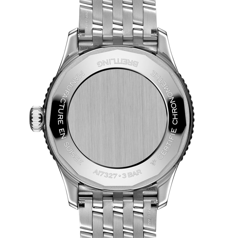 Back view of a Breitling Navitimer Automatic 36 wristwatch in stainless steel with engraved text, metal bracelet, model number A17327, and 3 BAR water resistance.