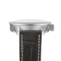Side view of the Breitling Navitimer Automatic 36, featuring a metal case, textured bezel, crown, anthracite dial, and a black leather strap with white stitching.