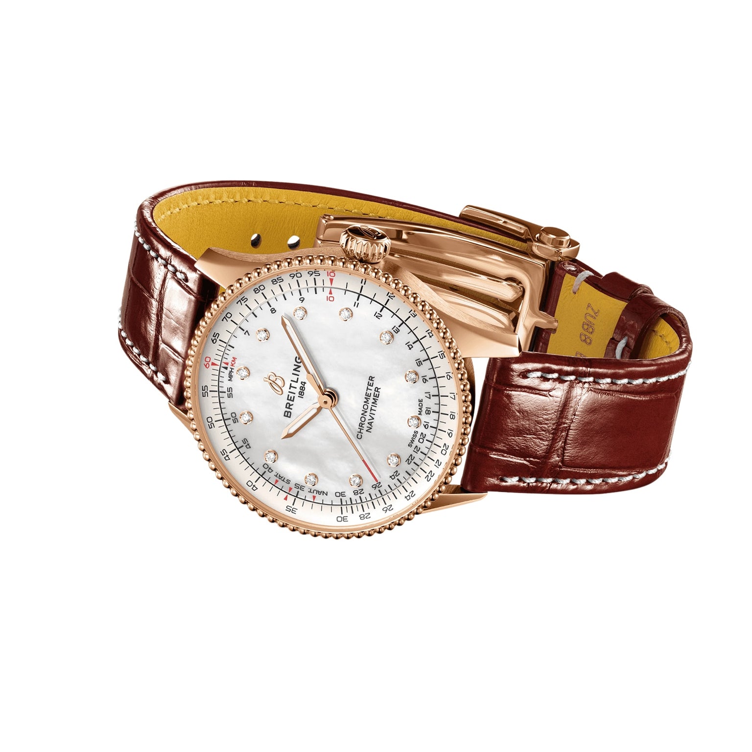 A Breitling Navitimer Automatic 36 wristwatch with a gold case, white dial, brown leather strap, and multiple indicators is shown on a white background.