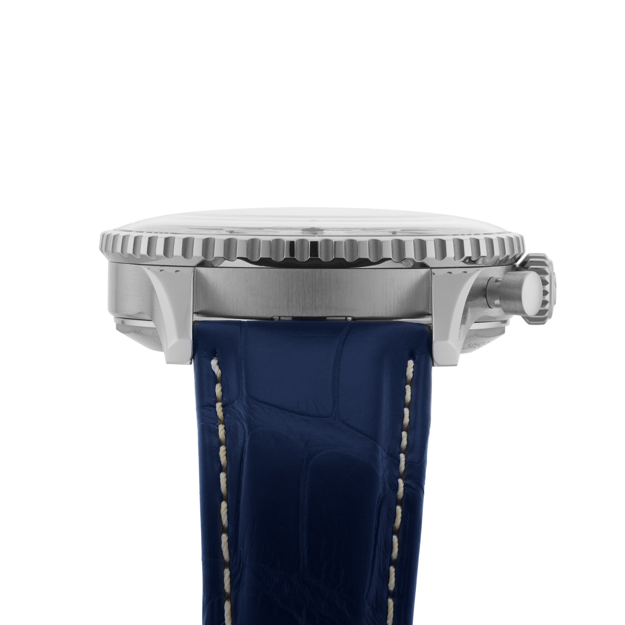 Side view of a Breitling Navitimer B01 Chronograph 41 with a stainless steel case, ridged bezel, crown, and blue leather strap with white stitching.