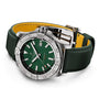 The Breitling Avenger Automatic 42 wristwatch features a green dial, stainless steel case, military leather strap with yellow lining, and a rotating bezel, shown against a white background.