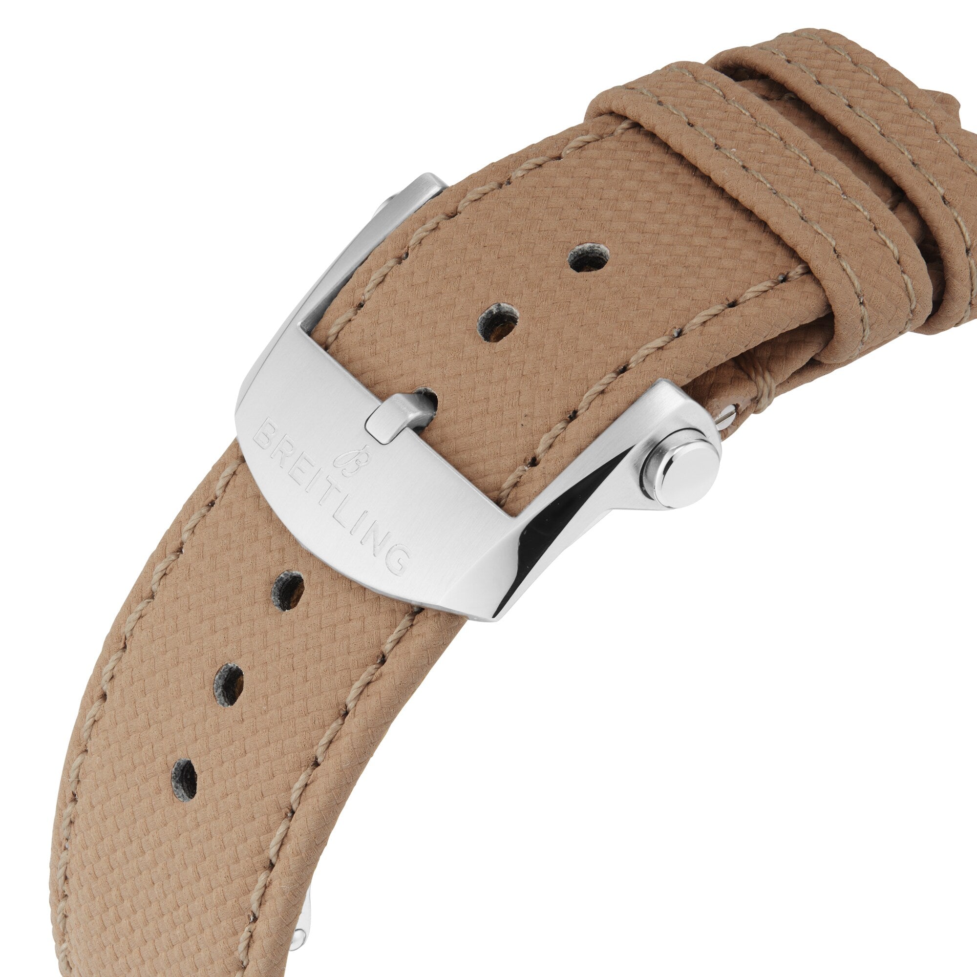 Close-up of a tan textured watch strap with a stainless steel buckle engraved with Breitling, reflecting the military style of the Avenger B01 Chronograph 44.