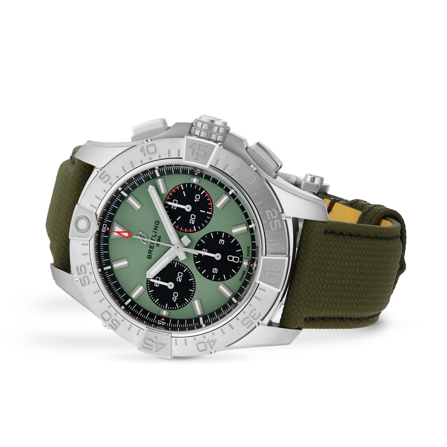 A Breitling Avenger B01 Chronograph 44 watch with a silver case, green dial, black subdials, and an olive green fabric strap—military-inspired—displayed at an angle.