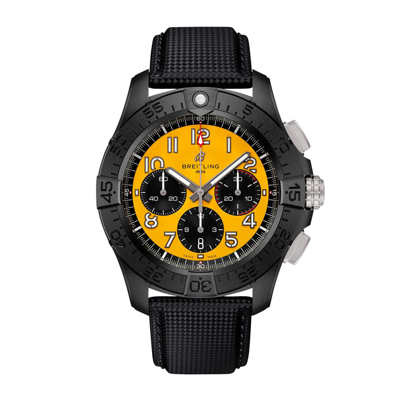 The Breitling Avenger B01 Chronograph 44 Night Mission features a black case in ceramic and titanium, a yellow dial with black subdials, bold orange numerals, and a black textured strap, shown against a white background.