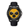 The Breitling Avenger B01 Chronograph 44 Night Mission features a black case in ceramic and titanium, a yellow dial with black subdials, bold orange numerals, and a black textured strap, shown against a white background.
