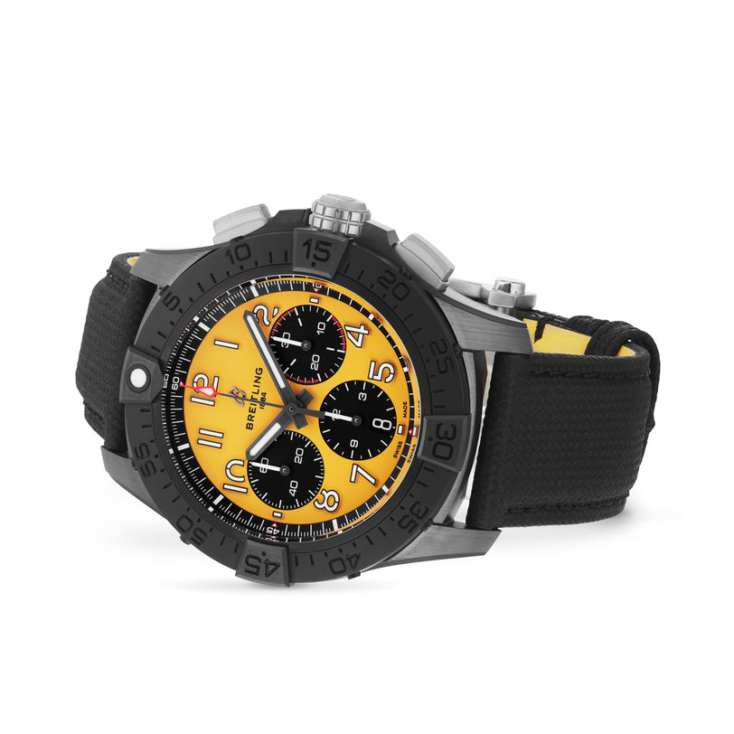 The Breitling Avenger B01 Chronograph 44 Night Mission is a black and yellow wristwatch featuring a yellow dial, three subdials, black bezel, ceramic and titanium case, and a black strap.