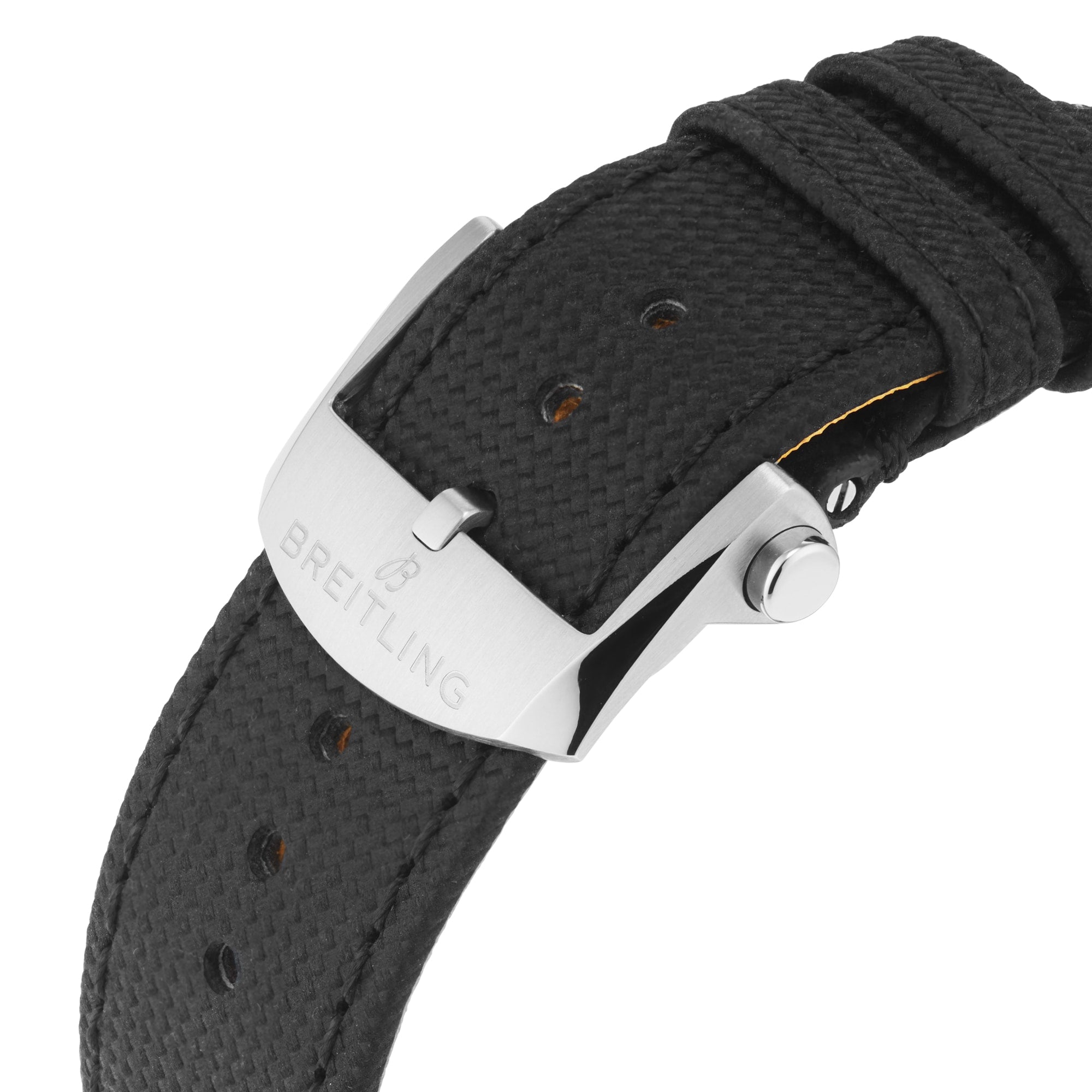 Close-up of a black textured watch strap with a silver buckle engraved with the Breitling logo, designed for the Avenger B01 Chronograph 44 Night Mission by Breitling, featuring a ceramic and titanium case.