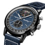 The Breitling Top Time B21 Shelby Cobra is a blue chronograph watch with an open-heart dial and perforated leather strap.