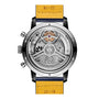 Back view of the Breitling Top Time B21 Shelby Cobra, revealing its open automatic movement, labeled parts, and a yellow leather strap marked “22-18,” inspired by the iconic Shelby Cobra.