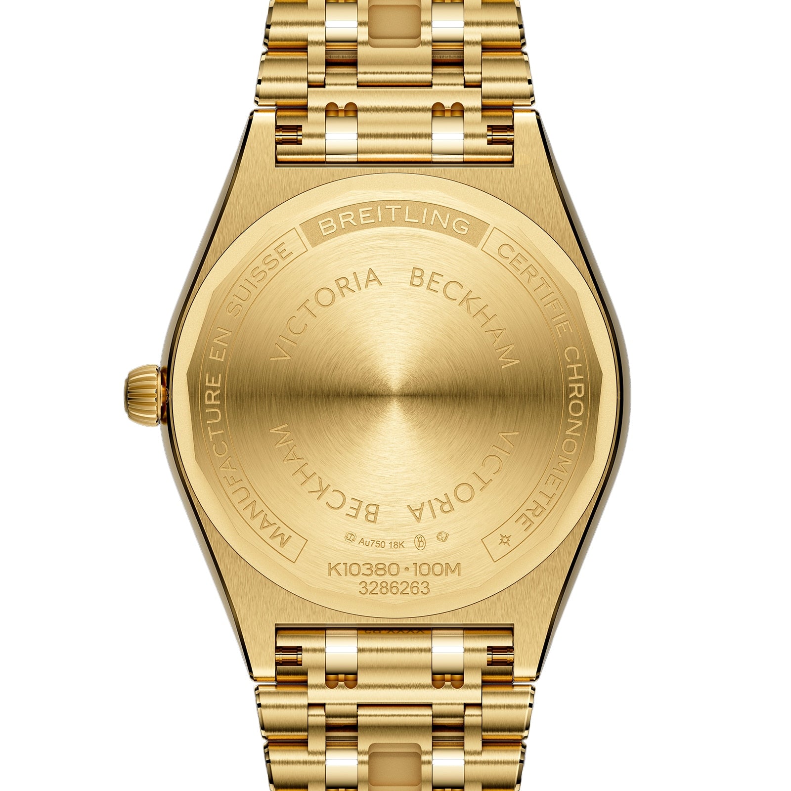 Close-up of the back of a Breitling Chronomat Automatic 36 Victoria Beckham watch in 18K yellow gold, engraved with collaboration details and official branding.