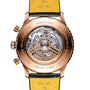 The back of the Breitling Navitimer B01 Chronograph 46 unveils its detailed mechanical movement, engraved case elements, and a bold black and yellow leather strap.