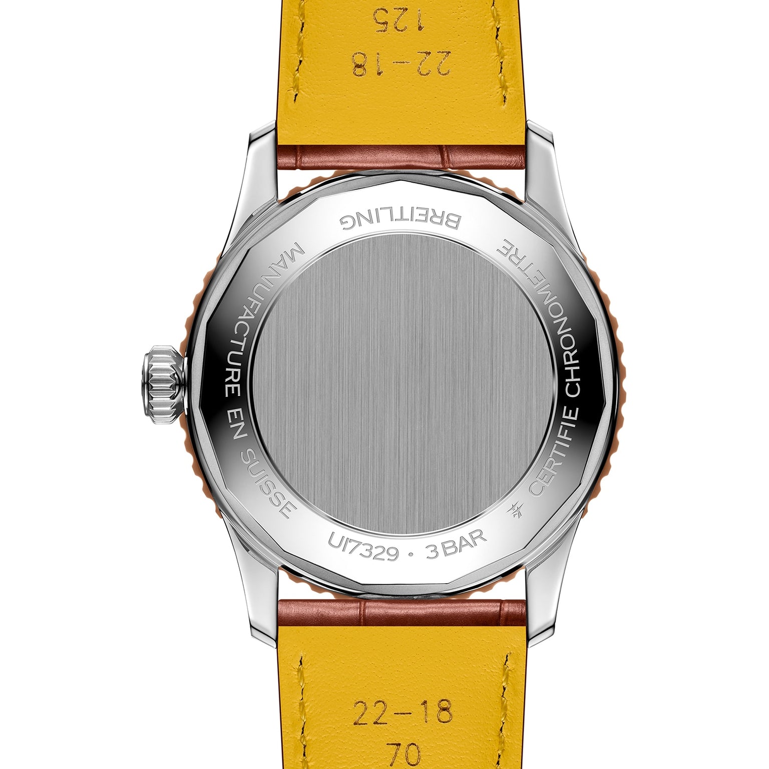 A close-up of the back of the Breitling Navitimer Automatic 41 wristwatch, featuring a yellow leather strap, stainless steel case, and aviation-inspired engravings.