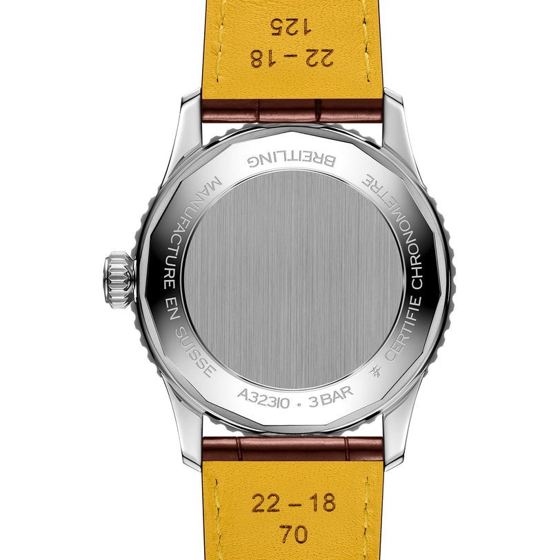 The image shows the back of a 41mm Breitling Navitimer Automatic GMT with a stainless steel case, yellow leather strap, and engraved details on the case and strap.