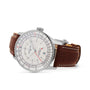 The Breitling Navitimer Automatic GMT 41 features a silver stainless steel 41mm case, white dial, brown leather strap, and date display at 3 o’clock, shown from an angled view.