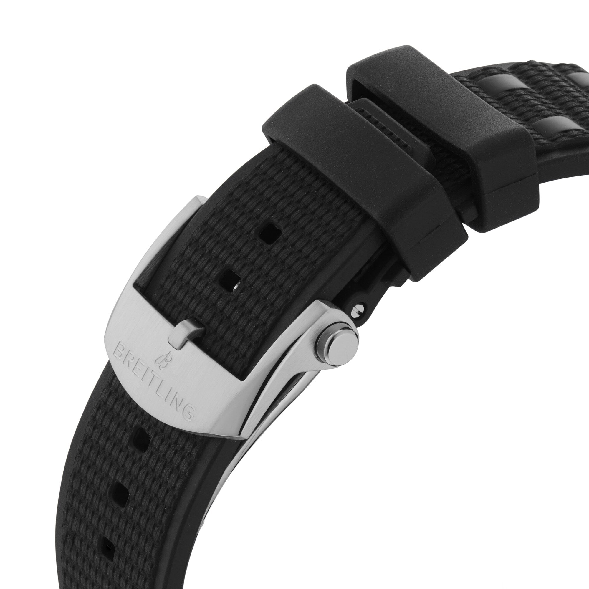 Close-up of a black Breitling Chronomat Automatic GMT 40 watch strap with a silver buckle and textured pattern.