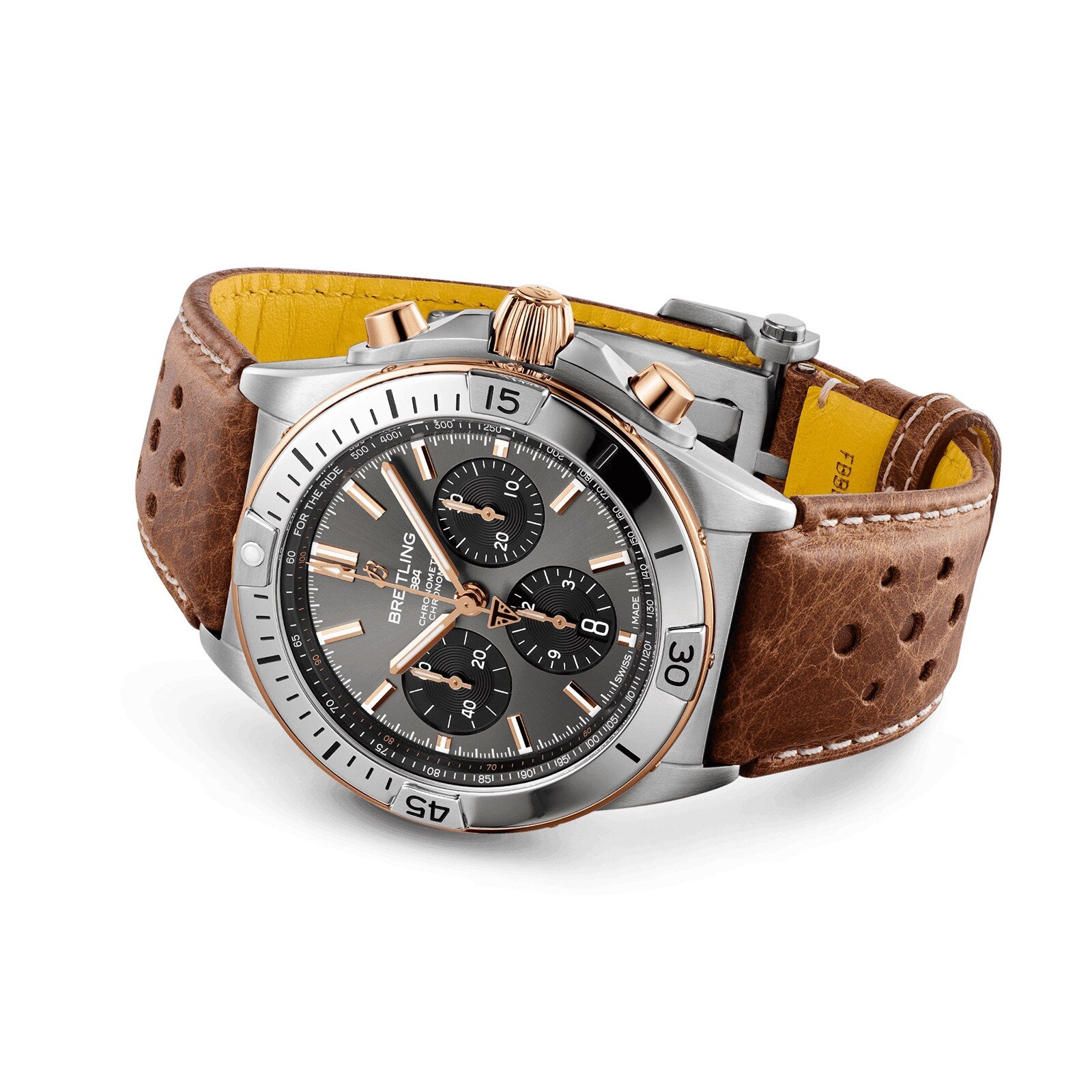 The Breitling Chronomat B01 42 Triumph, featuring a black dial, silver bezel, and brown leather strap, is displayed at an angle.