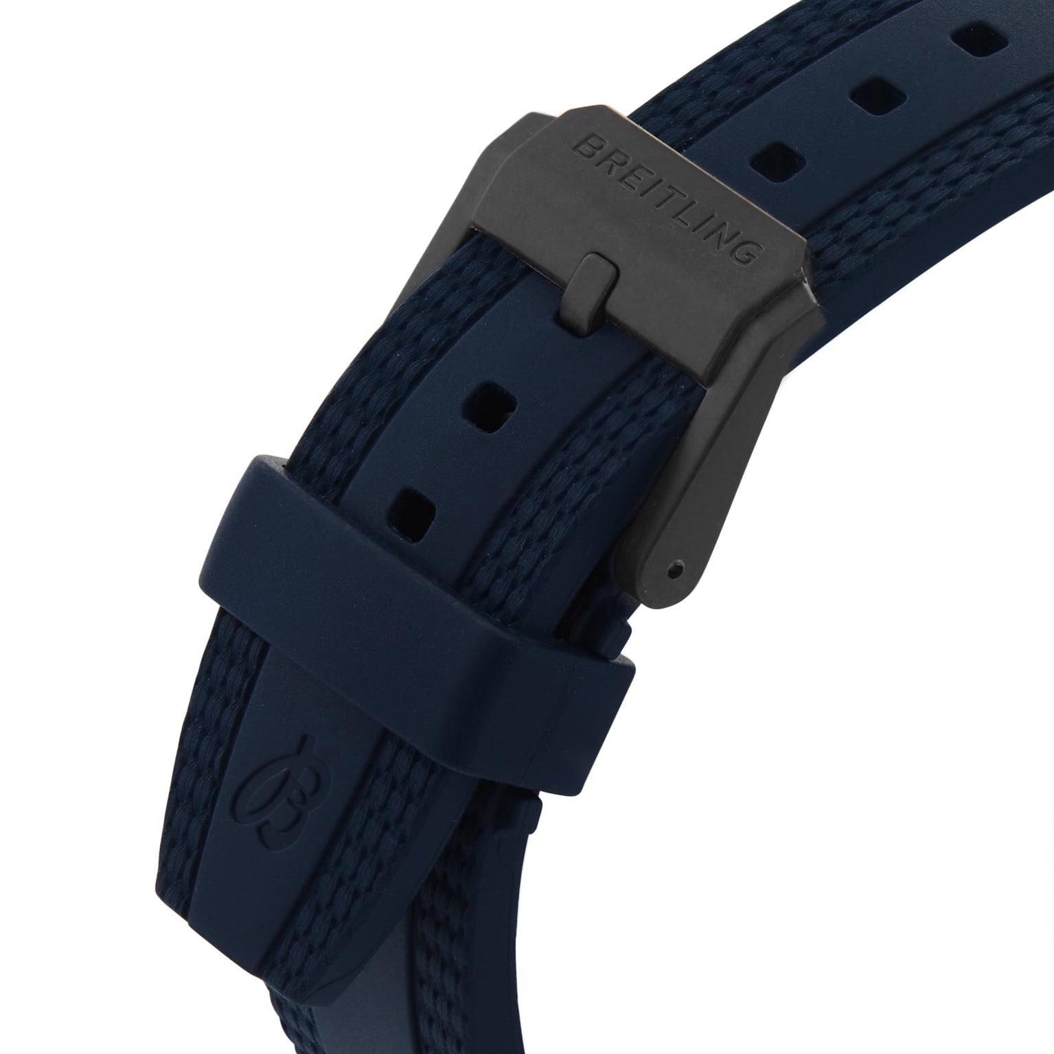 Close-up of a navy blue Breitling Endurance Pro 38 watch strap with black buckle, detailed stitching, and the Breitling logo on the clasp and loop, crafted from lightweight Breitlight material.