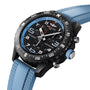 The Breitling Endurance Pro 38 is an athleisure watch with a black dial, blue bezel, light blue textured rubber strap, multiple subdials, white markings, and an ultra-lightweight Breitlight case.