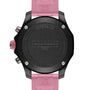 Close-up of the back of a black Breitling Endurance Pro 38 watch with a pink strap.