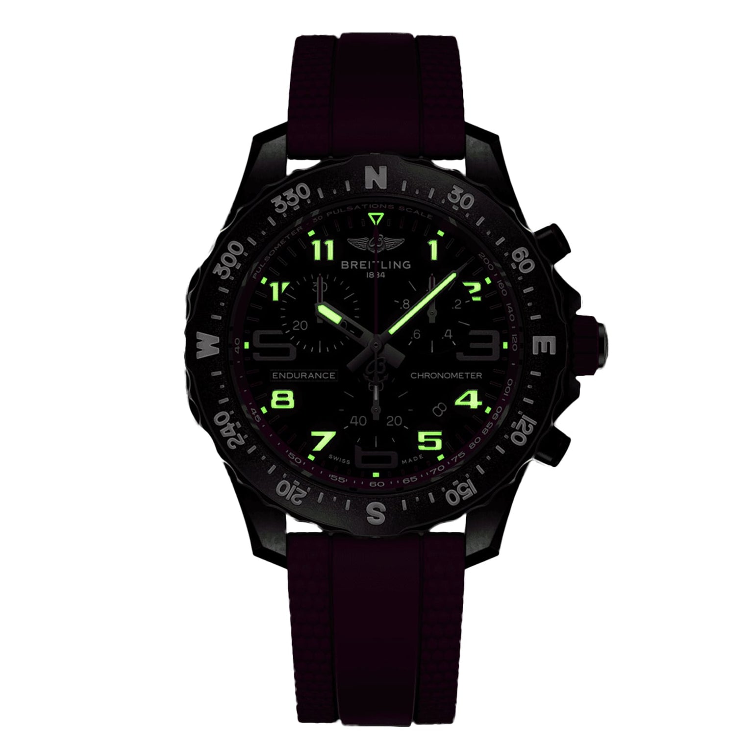 A black Breitling Endurance Pro 38 watch with a rubber strap, luminous green numbers and hands, compass bezel, and lightweight Breitlight case is displayed against a white background.