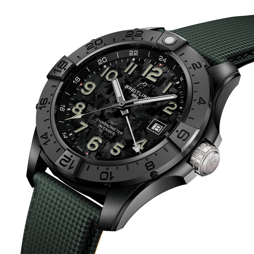The Breitling Avenger Automatic GMT 44 Night Mission features a textured black dial, aviation-inspired design, luminous hands, large numerals on a black bezel, and a green strap.