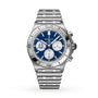 The Breitling Chronomat B01 42 NFL Indianapolis Colts Edition is a silver chronograph watch featuring a blue dial with three subdials on a metal link bracelet.