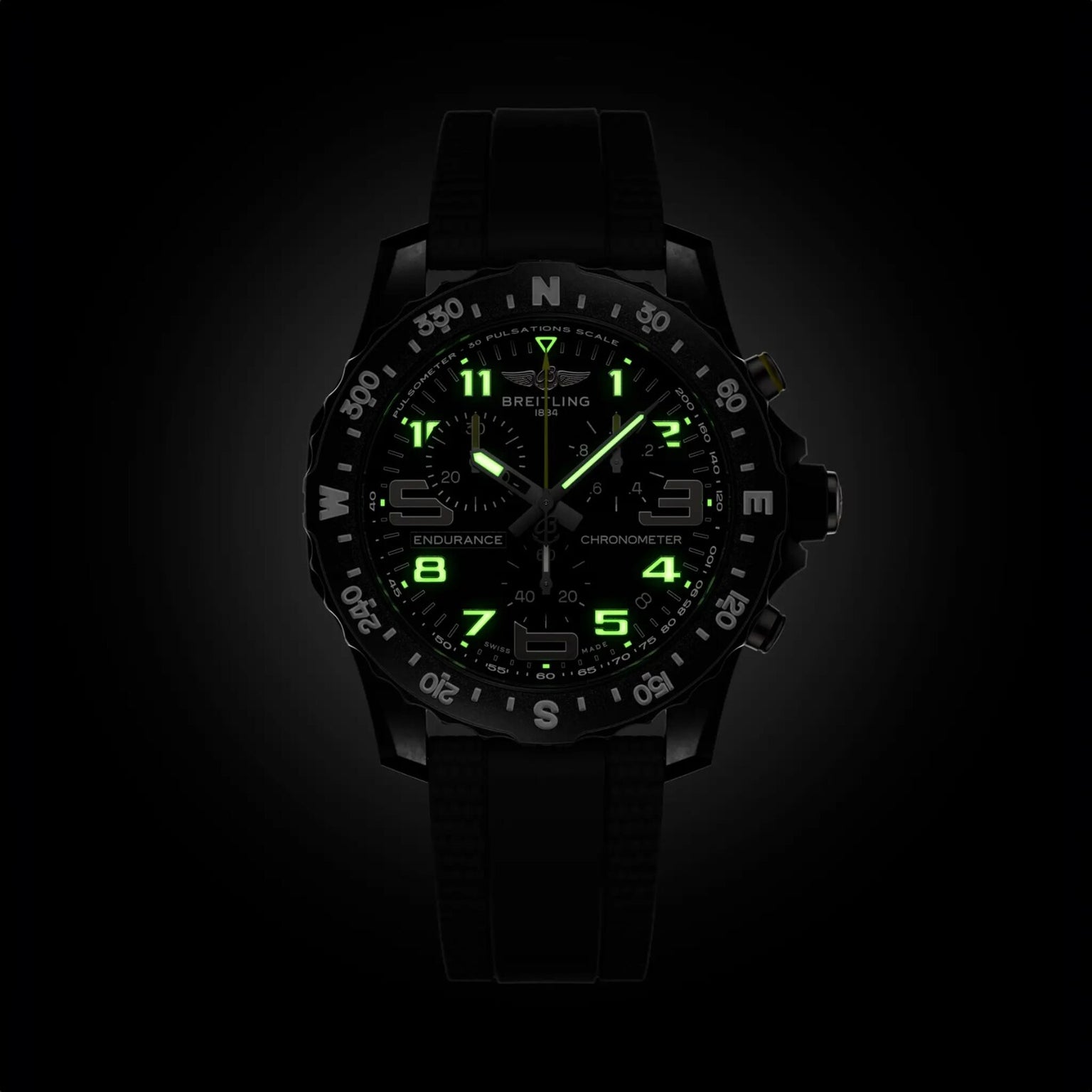 The black Breitling Endurance Pro 44 athleisure watch features ultra-lightweight Breitlight® construction and luminous green hands, markers, and numerals that stand out brilliantly in the dark.