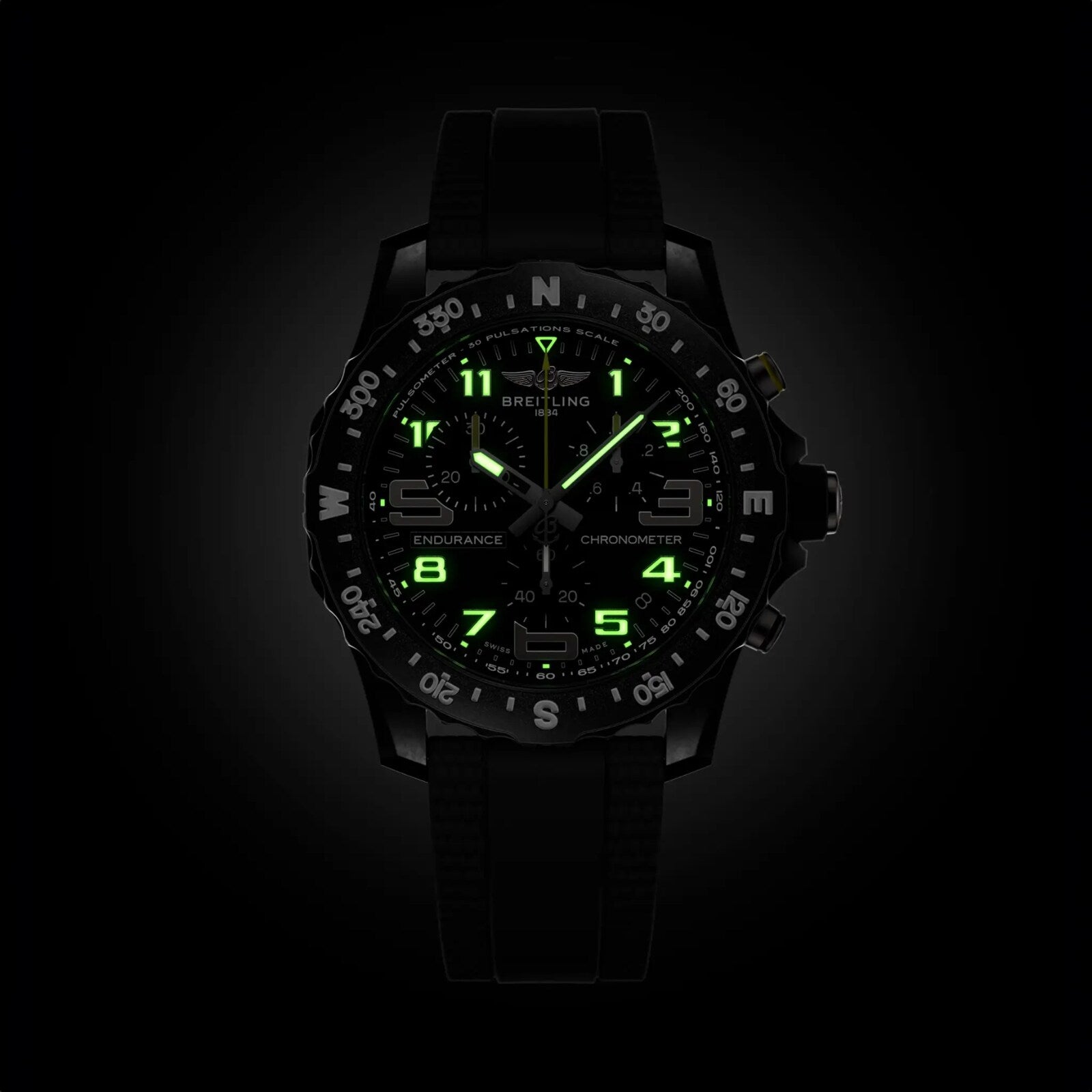 The black Breitling Endurance Pro 44 athleisure watch features ultra-lightweight Breitlight® construction and luminous green hands, markers, and numerals that stand out brilliantly in the dark.
