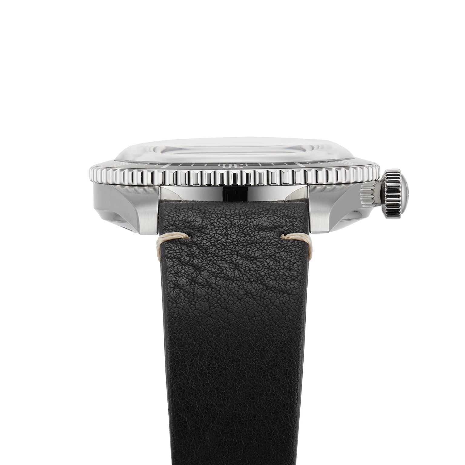 Side view of the Oris Divers Sixty‑Five wristwatch featuring a black leather strap and a silver case with a ridged bezel.