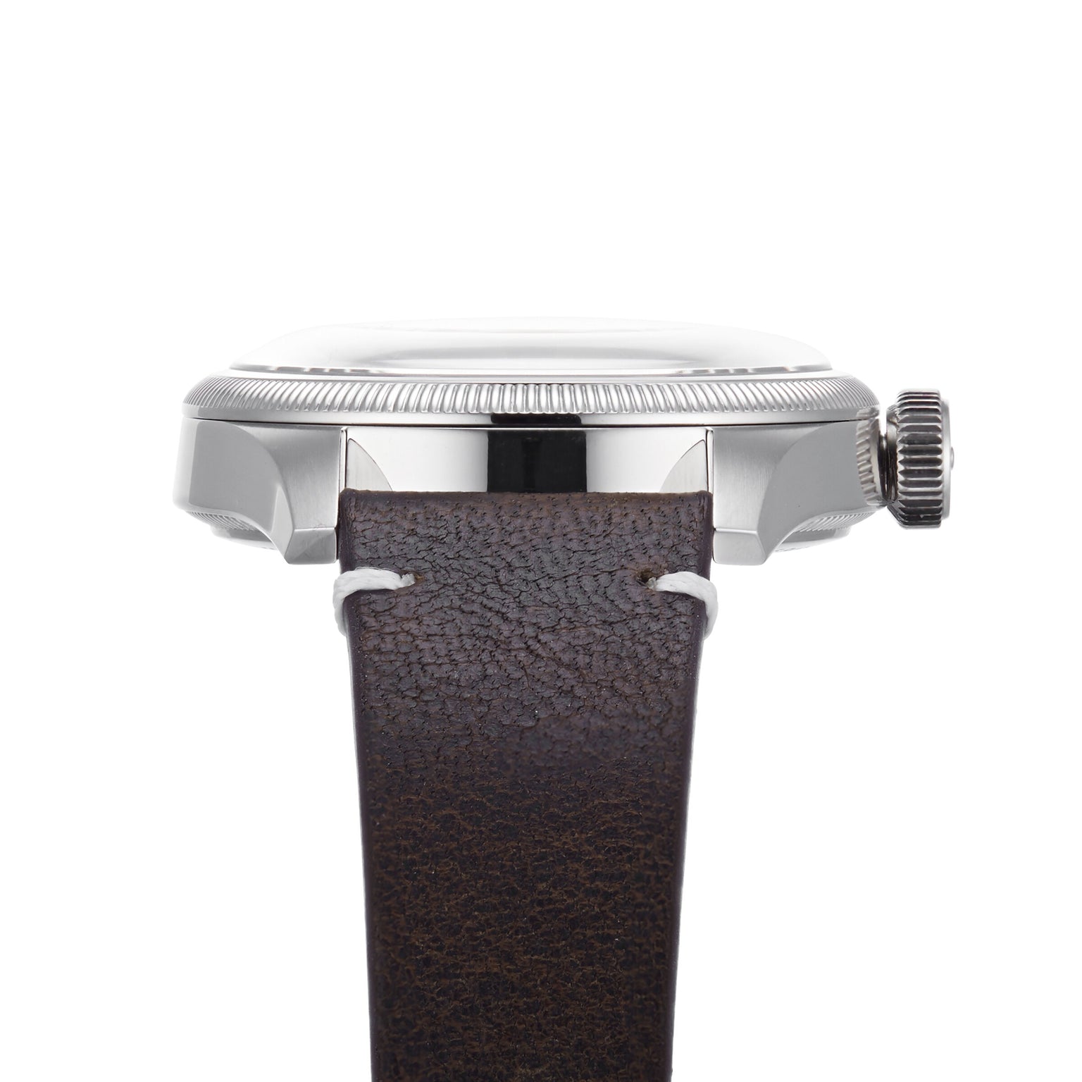 Side view of the Oris Big Crown Oris X Cervo Volante, showcasing a silver case, fluted bezel and crown, along with a brown textured leather strap with white stitching—designed for professional pilots.