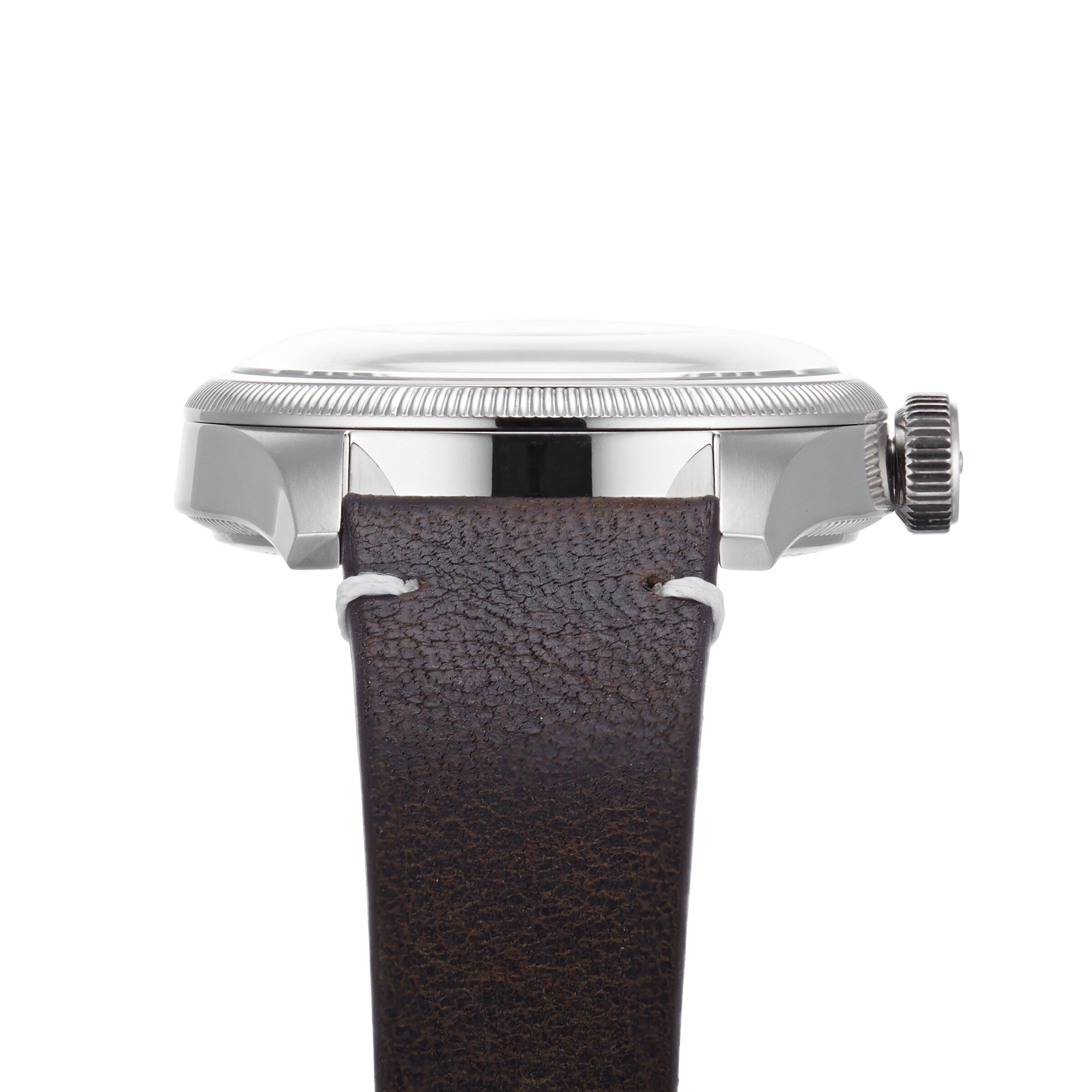 Side view of the Oris Big Crown Oris X Cervo Volante, showcasing a silver case, fluted bezel and crown, along with a brown textured leather strap with white stitching—designed for professional pilots.