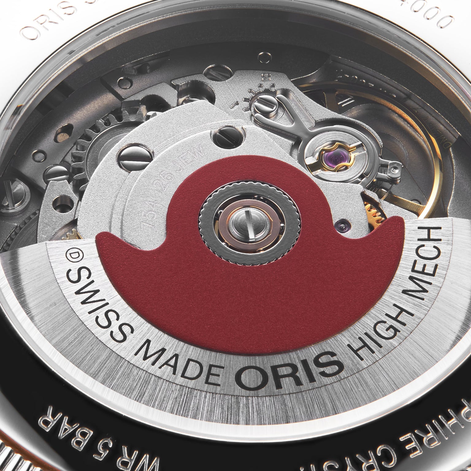 Close-up of the mechanical movement inside the Oris Big Crown X Cervo Volante, showcasing a red rotor and engraved SWISS MADE ORIS HIGH MECH text—a standout timepiece crafted for professional pilots.