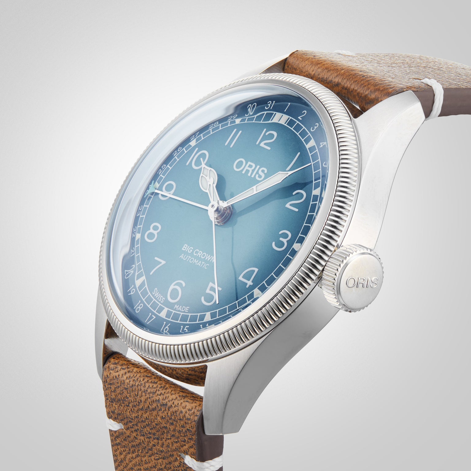 Close-up view of the Oris Big Crown Oris X Cervo Volante, featuring a blue dial, silver case, and brown leather strap—precision-crafted for professional pilots, shown displaying 10:10.