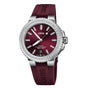 The Oris Aquis Date Diamonds wristwatch features a maroon dial, lab-grown diamond-set bezel, date display at 6 o’clock, and a matching maroon rubber strap.