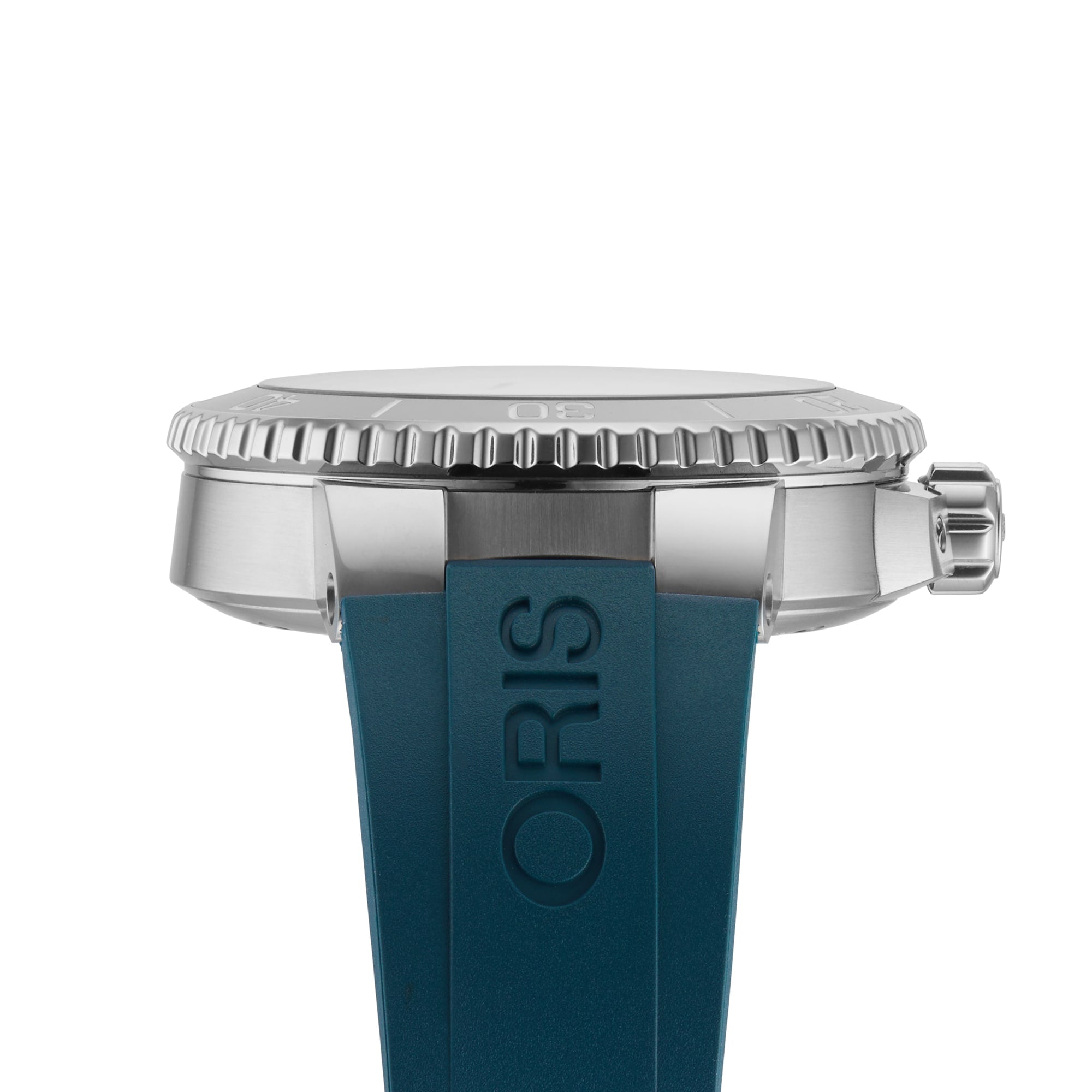 Side view of the Oris Aquis Small Second Date diver’s watch in silver, with a textured bezel and a blue rubber strap embossed with ORIS; Super-LumiNova accents offer excellent low-light readability.