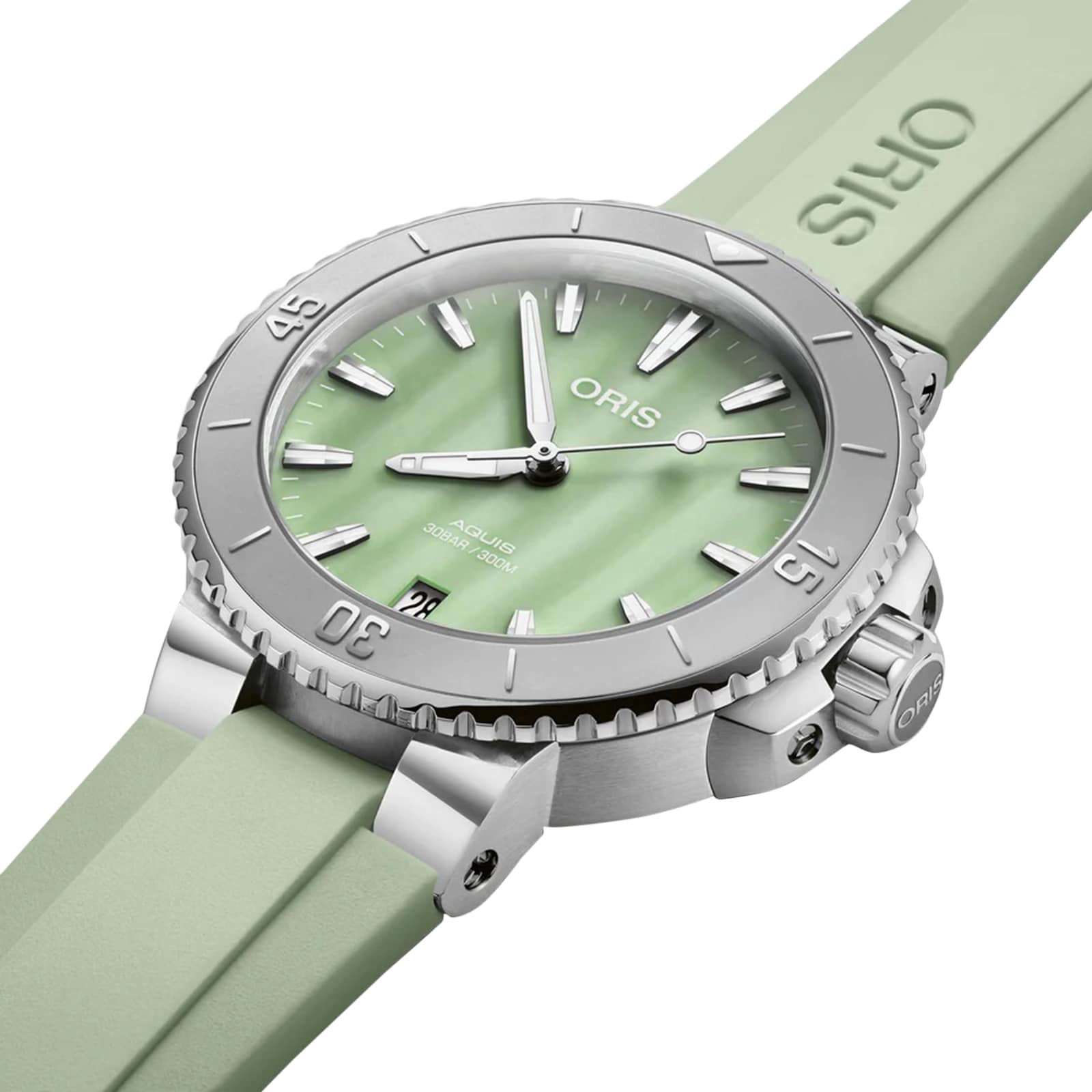 The Oris Aquis Date watch in mint green features a matching strap and silver bezel, displayed at an angle.