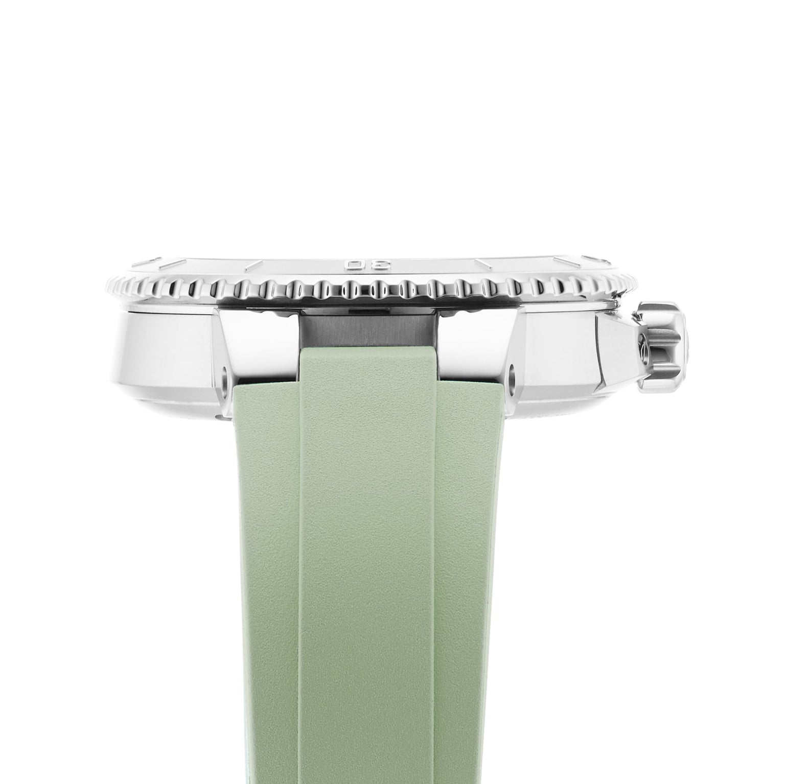 Side view of the Oris Aquis Date diver’s watch with a ridged bezel and light green rubber strap, displayed against a white background.