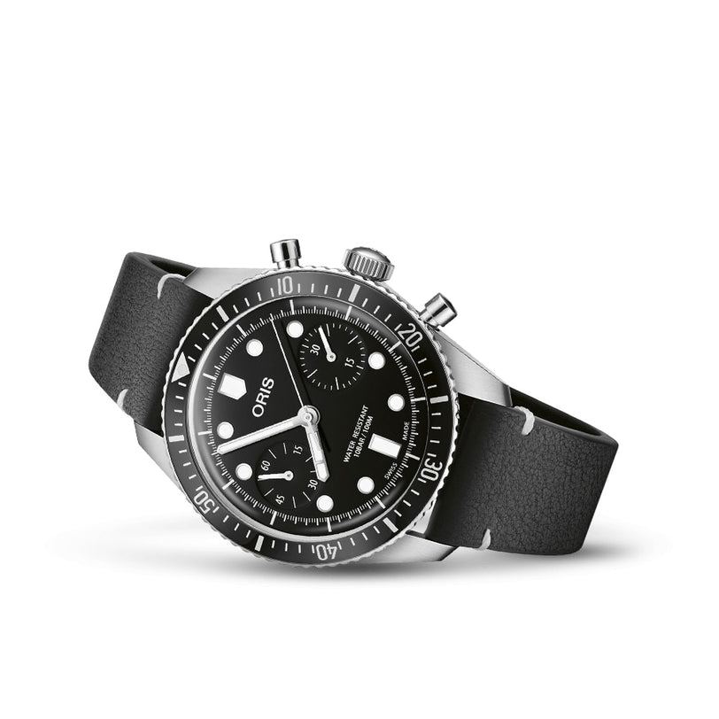 A black and silver Oris Divers Sixty‑Five Chronograph wristwatch with a black leather strap and a chronograph dial displayed on a white background.