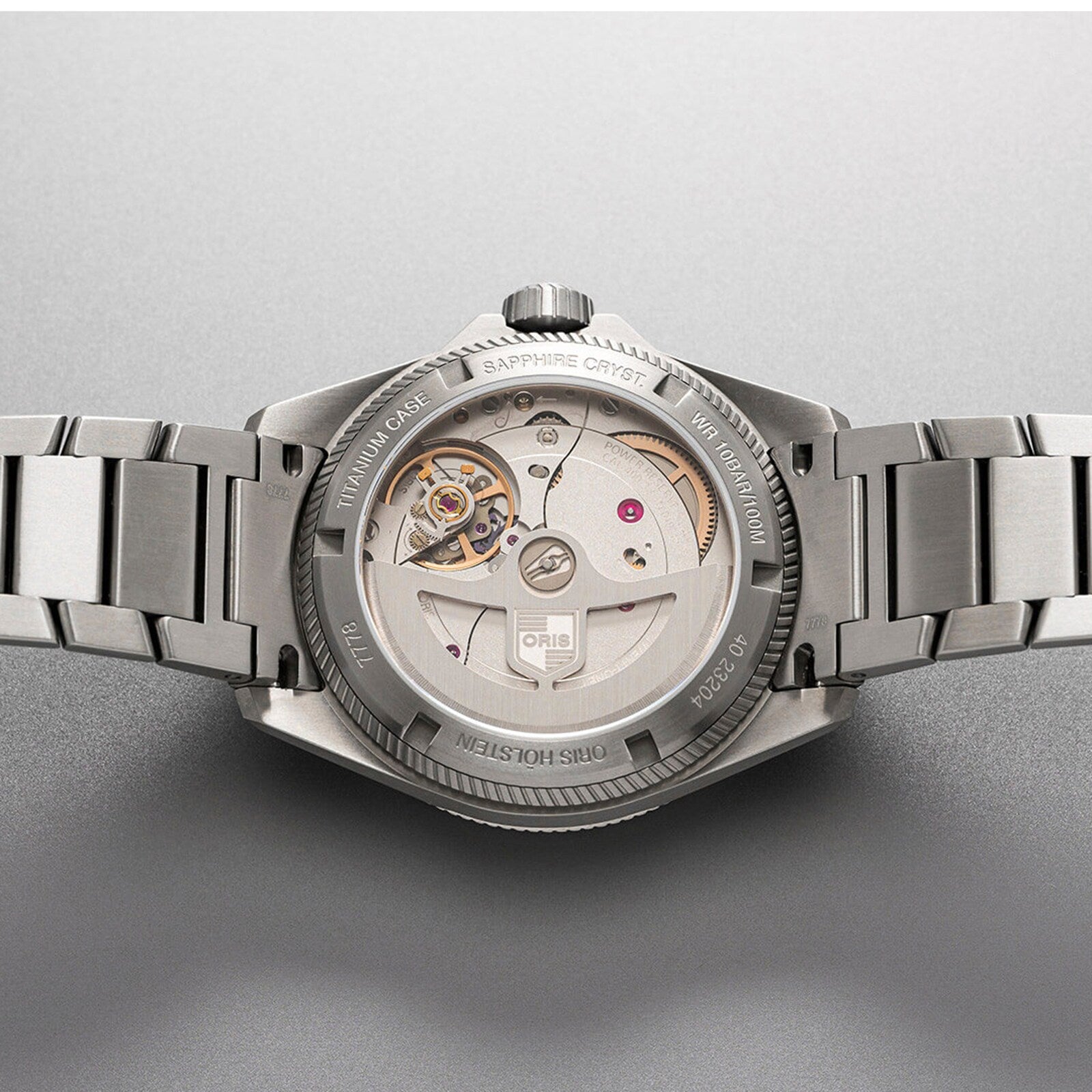 The Oris ProPilot X Calibre 400 Laser, crafted in stainless steel, displays its Calibre 400 automatic movement through a transparent sapphire case back.