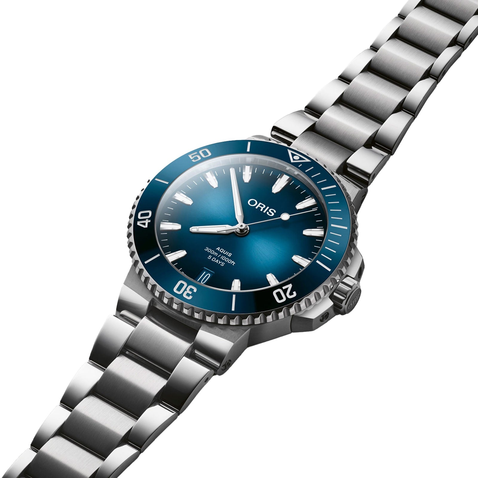 An Oris Aquis Date Calibre 400 stainless steel wristwatch with a blue dial and silver bracelet, displayed at an angle.