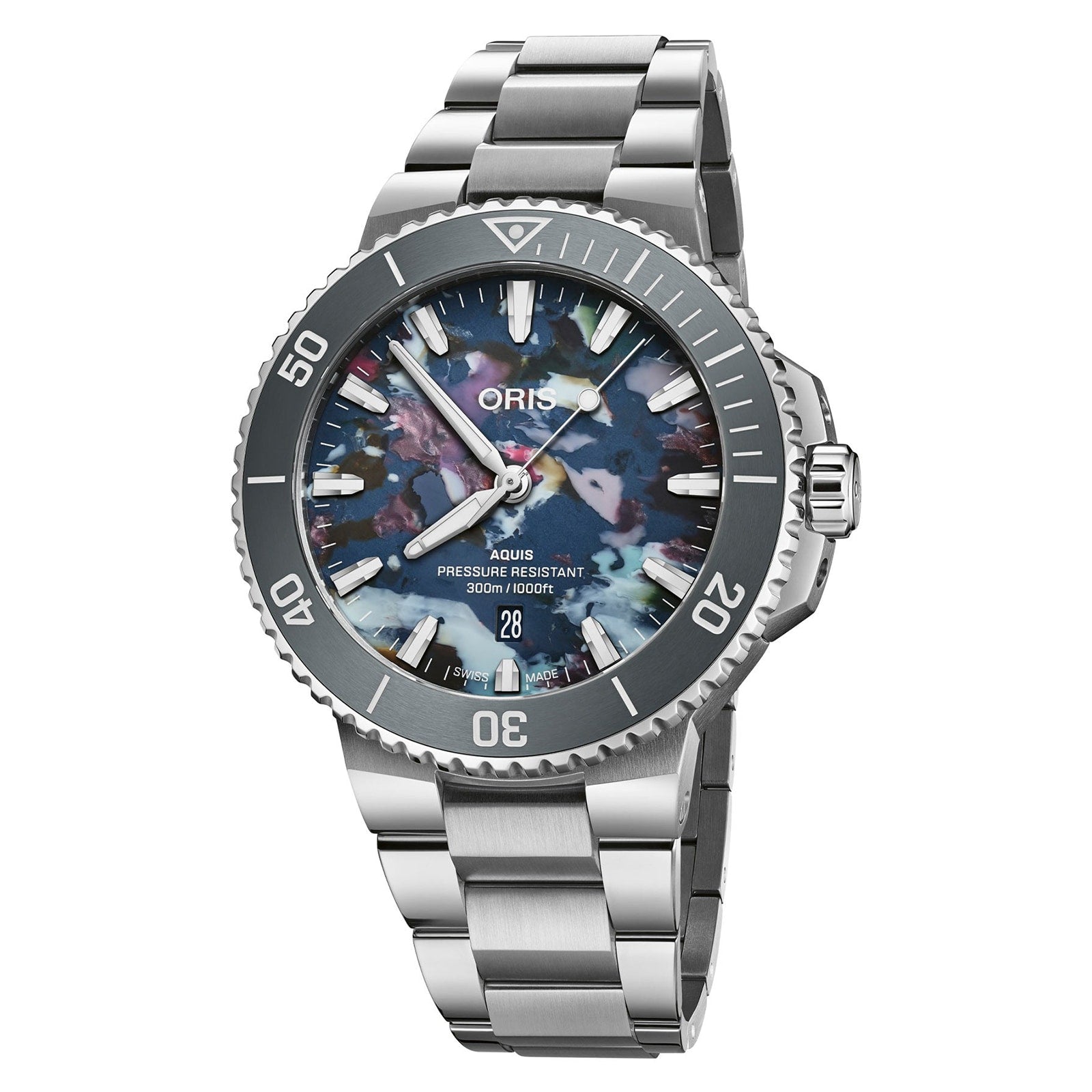 The Oris Aquis Date Upcycle is a stainless steel diving watch featuring a multicolored dial, rotating bezel, date display at 6 o’clock, and a metal bracelet.