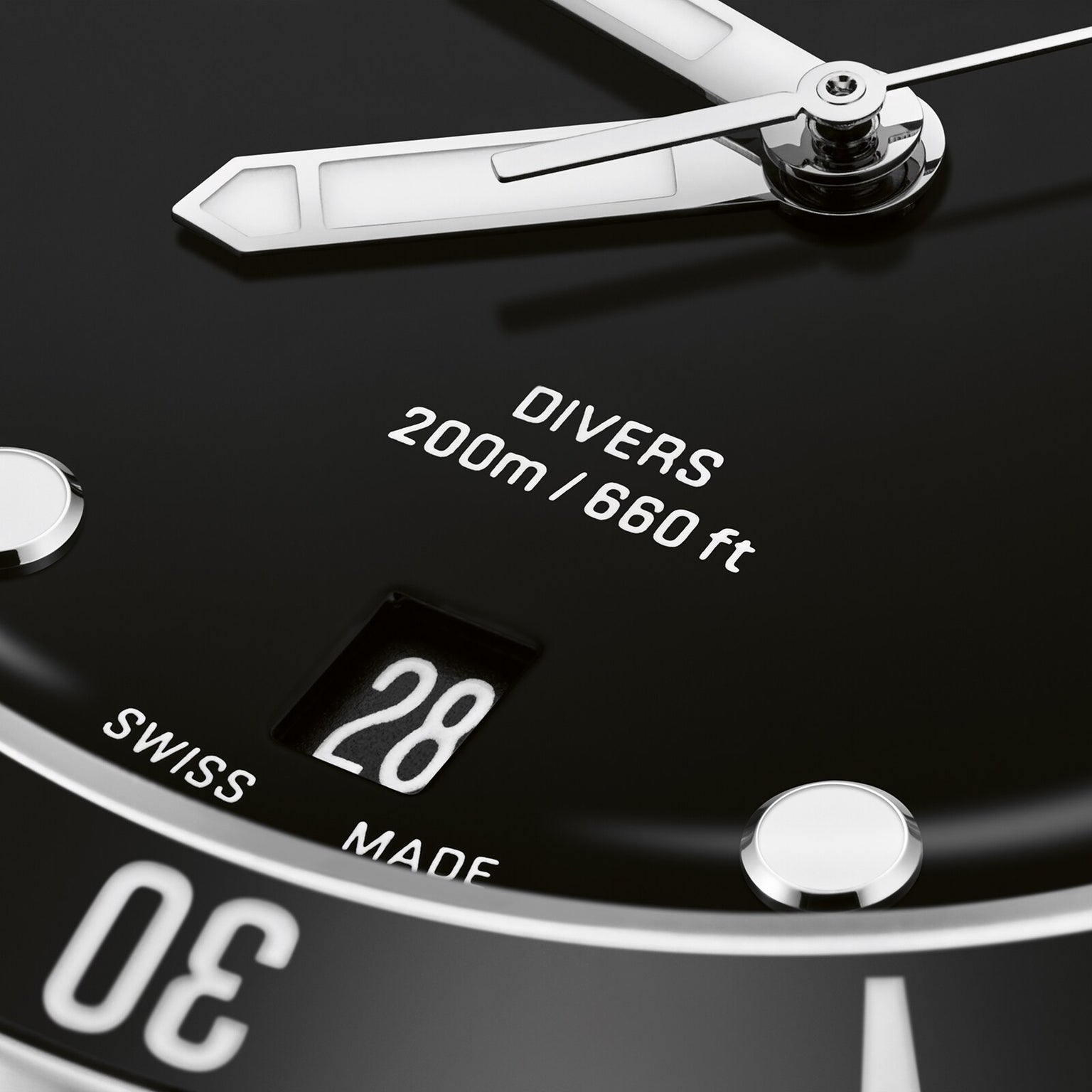 Close-up of the Oris Divers Date dive watch face, showcasing automatic movement, DIVERS 200m/660ft text, a date window at 28, and part of the SWISS MADE label.