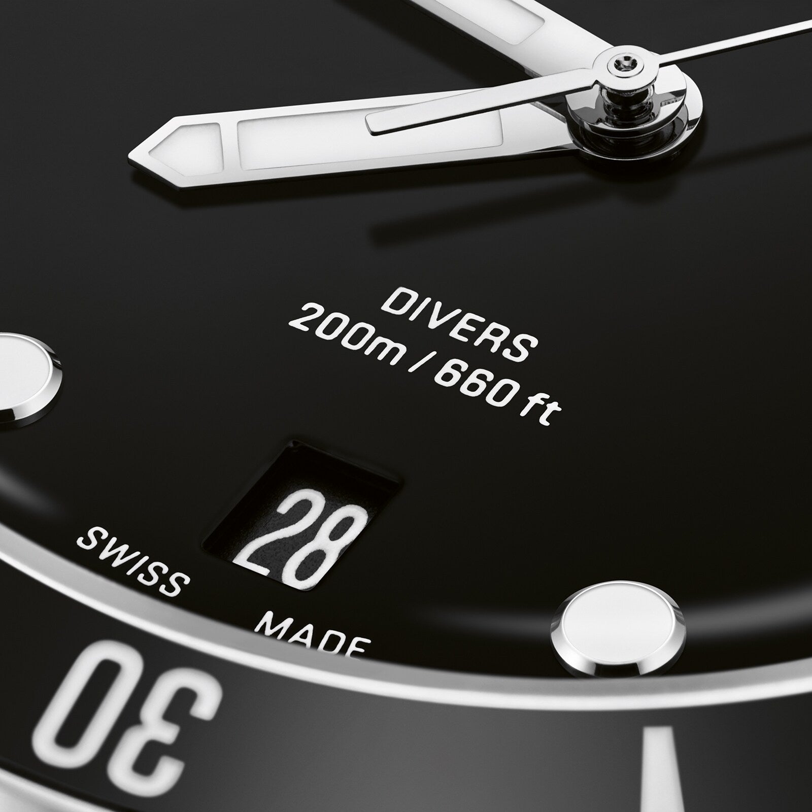 Close-up of the Oris Divers Date dive watch face, showcasing automatic movement, DIVERS 200m/660ft text, a date window at 28, and part of the SWISS MADE label.