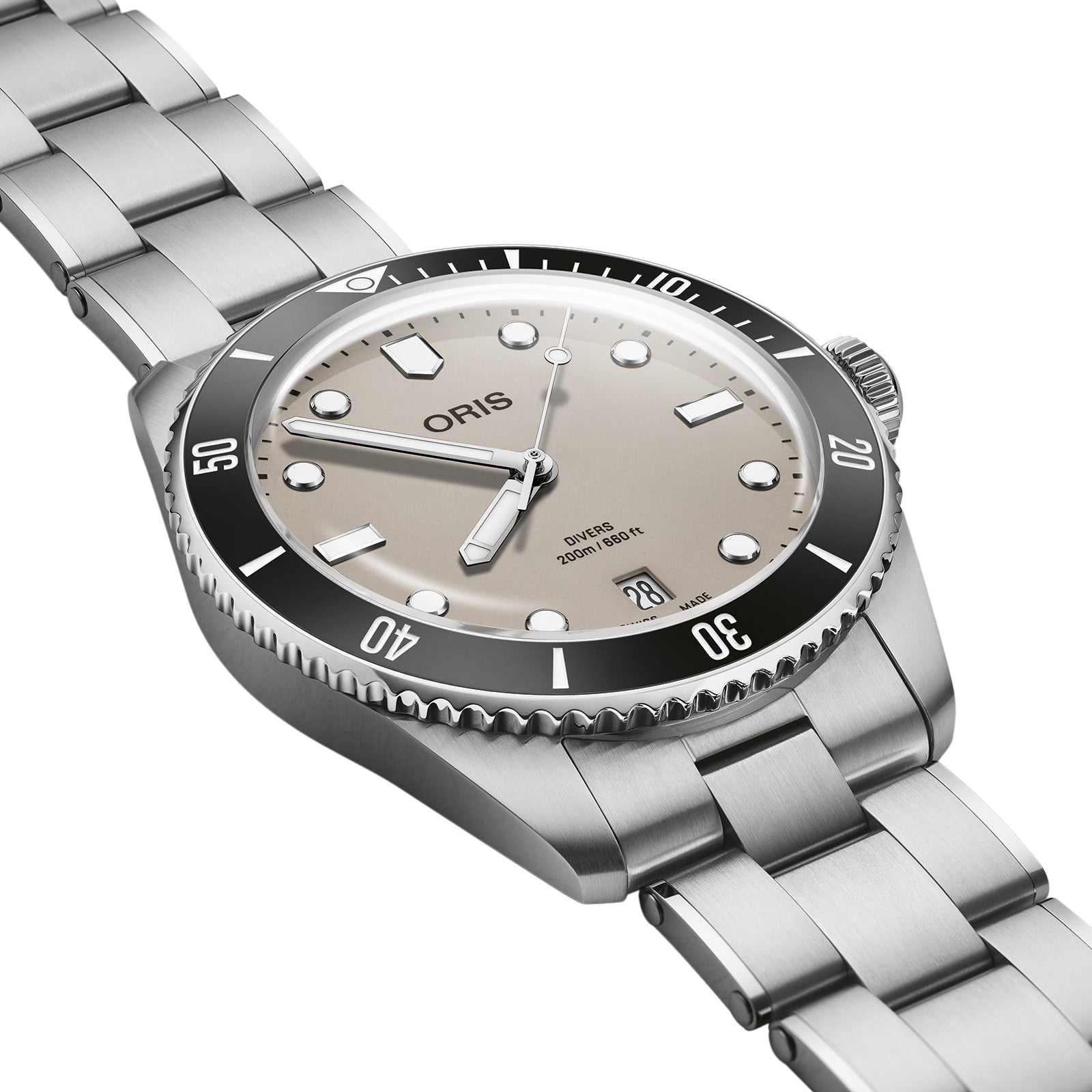 The Oris Divers Date watch features a silver dial, black bezel, luminous hour markers, and a date window at 6 o’clock, shown from an angle to highlight its reliable automatic movement.